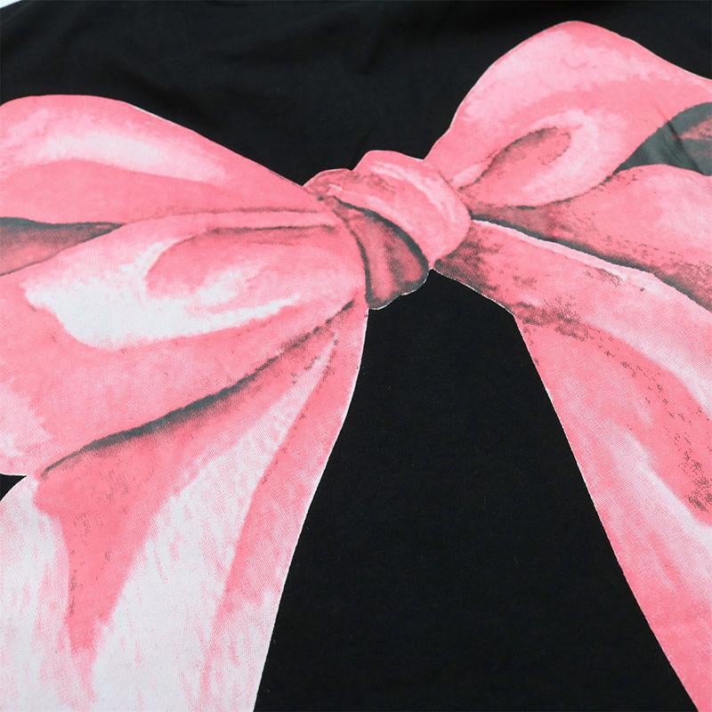 Justnotag T-shirt à manches courtes imprimé lettre avec nœud papillon énorme